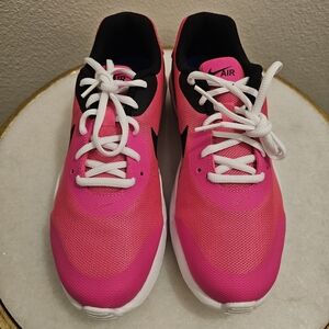 NWOT Nike Air Oketo womans pink sneakers fits size 8.